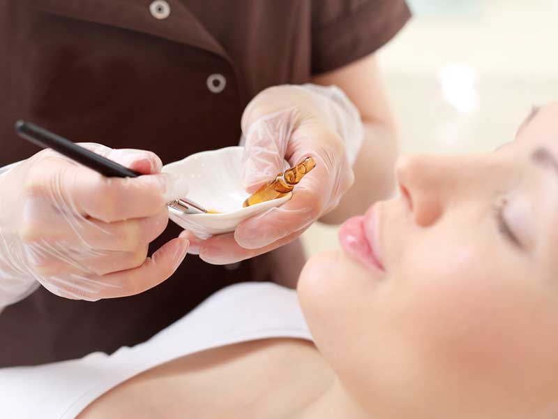 A women applying a face Ceram