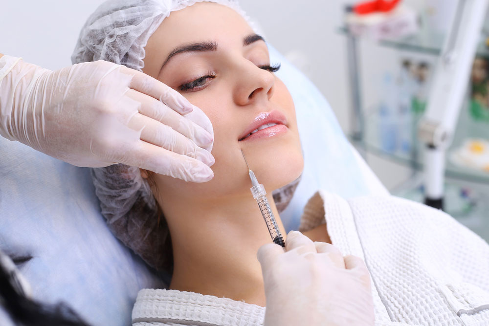 A women getting an injection on her face